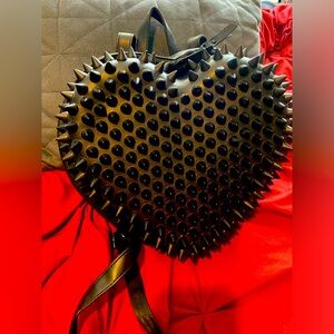 Spencer’s black spiked heart shaped purse backpack new without tags